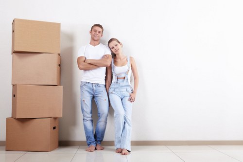 Man and van removal service loading boxes into a moving van