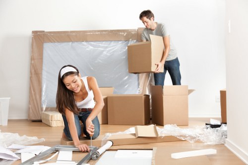 Removalvan furniture pick-up team collecting a sofa from a local home