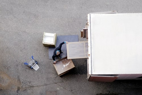 Office removals team loading desks and boxes for a local business move