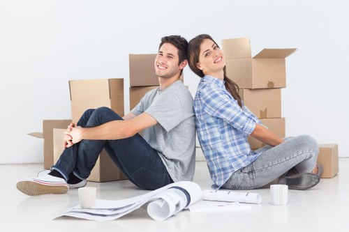 Careful loading of household items into a van for transport