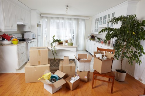Commercial moving team preparing office items for transport