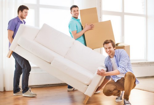 Professional man and van team securing items inside a vehicle