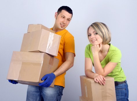 Mover handling furniture carefully at a residential property