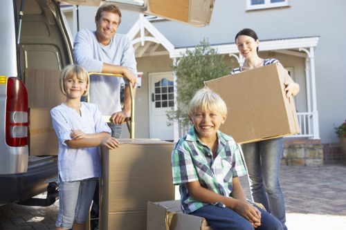 Removal van beside a busy residential property during a quoted move