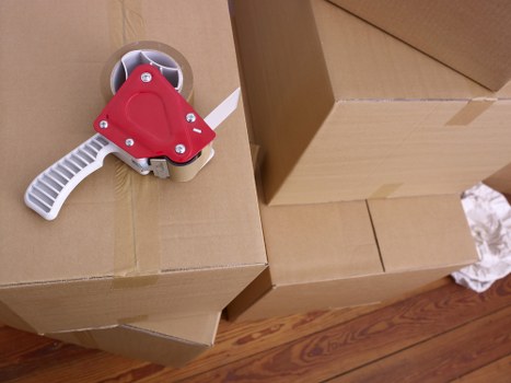 House moving team unloading boxes at a new property in Removalvan