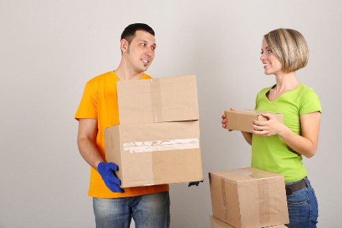 Furniture and boxes being loaded into a moving truck