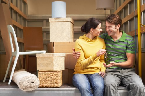 Loading furniture and boxes into a removals van for a local move