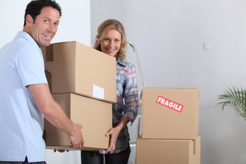 Removal van outside a home with moving equipment ready